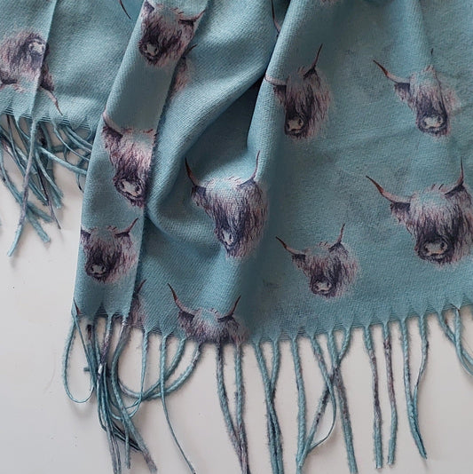 Mint coloured Highland Cow Scarf with Tassels on white background
