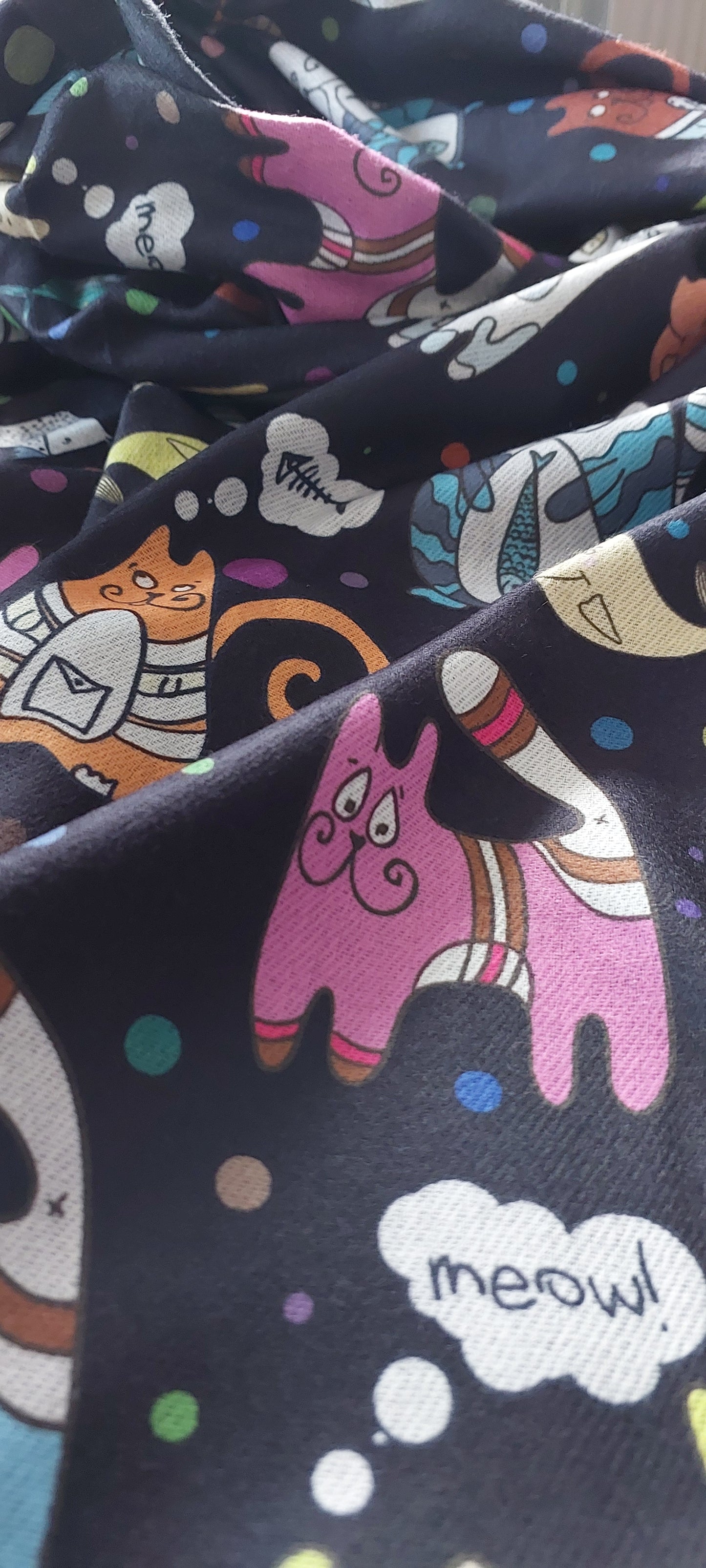 Pashmina with colourful cat-themed pattern on a black background