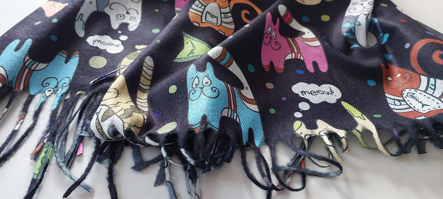 Colourful scarf with cartoon cat designs on a white background