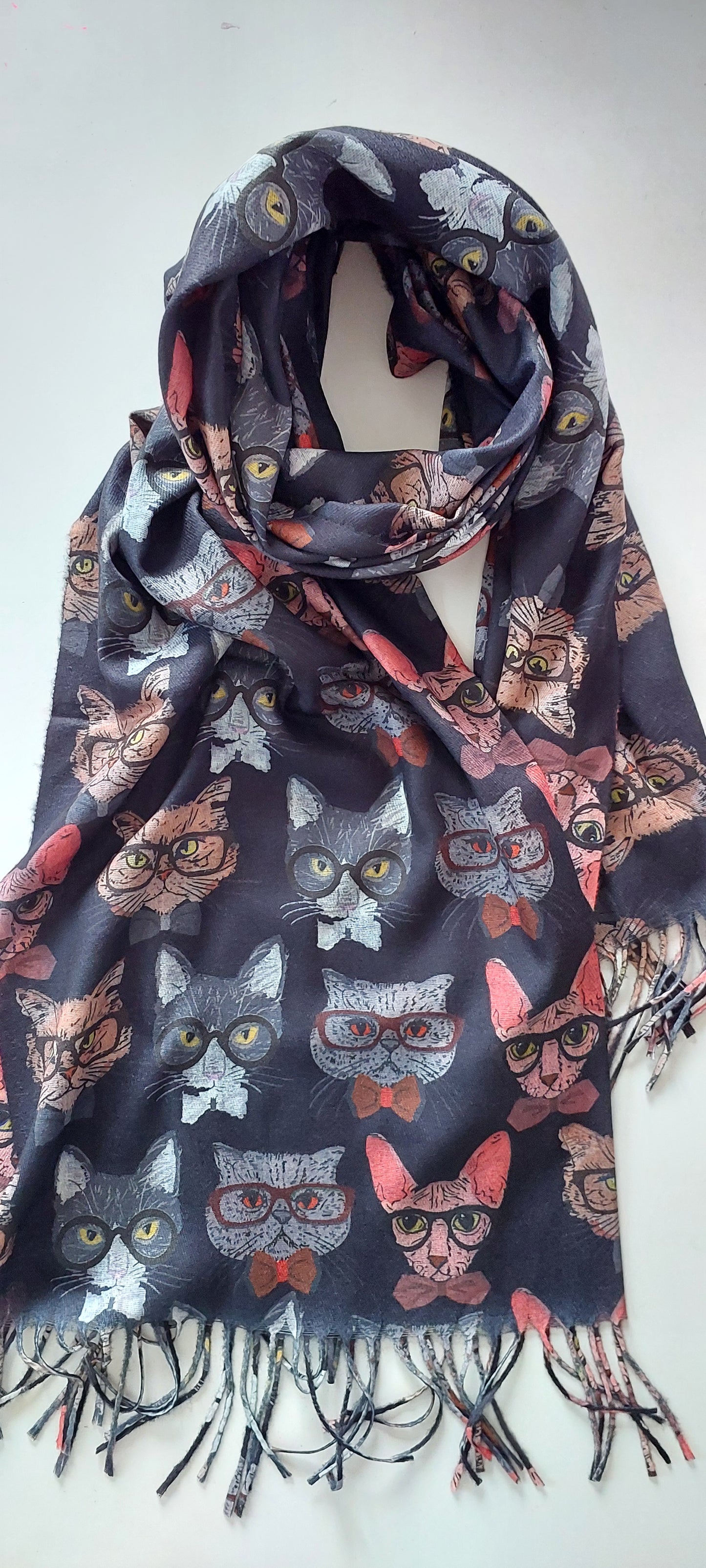 Black scarf with colourful cats in glasses pattern on a white background