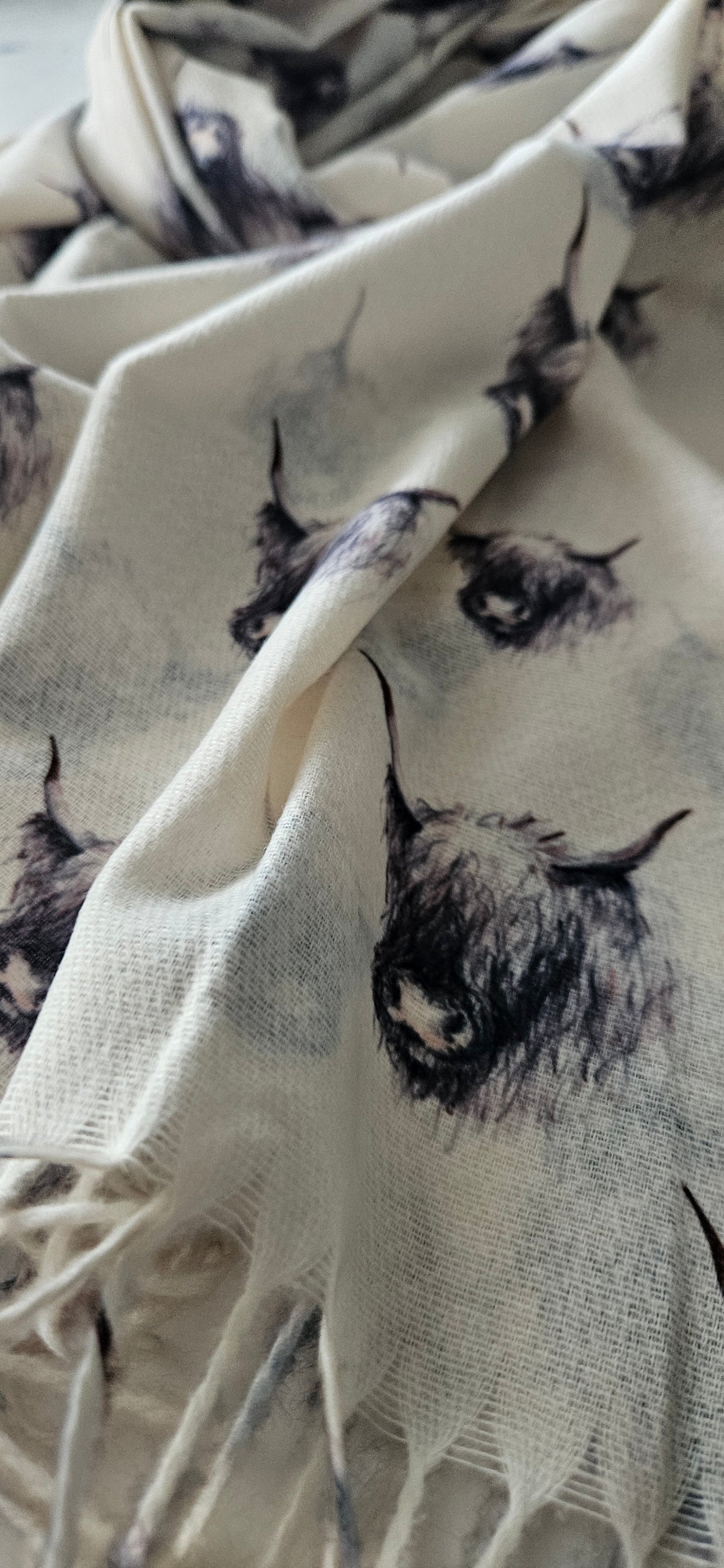 Close-up of cream black & white highland cow pattern