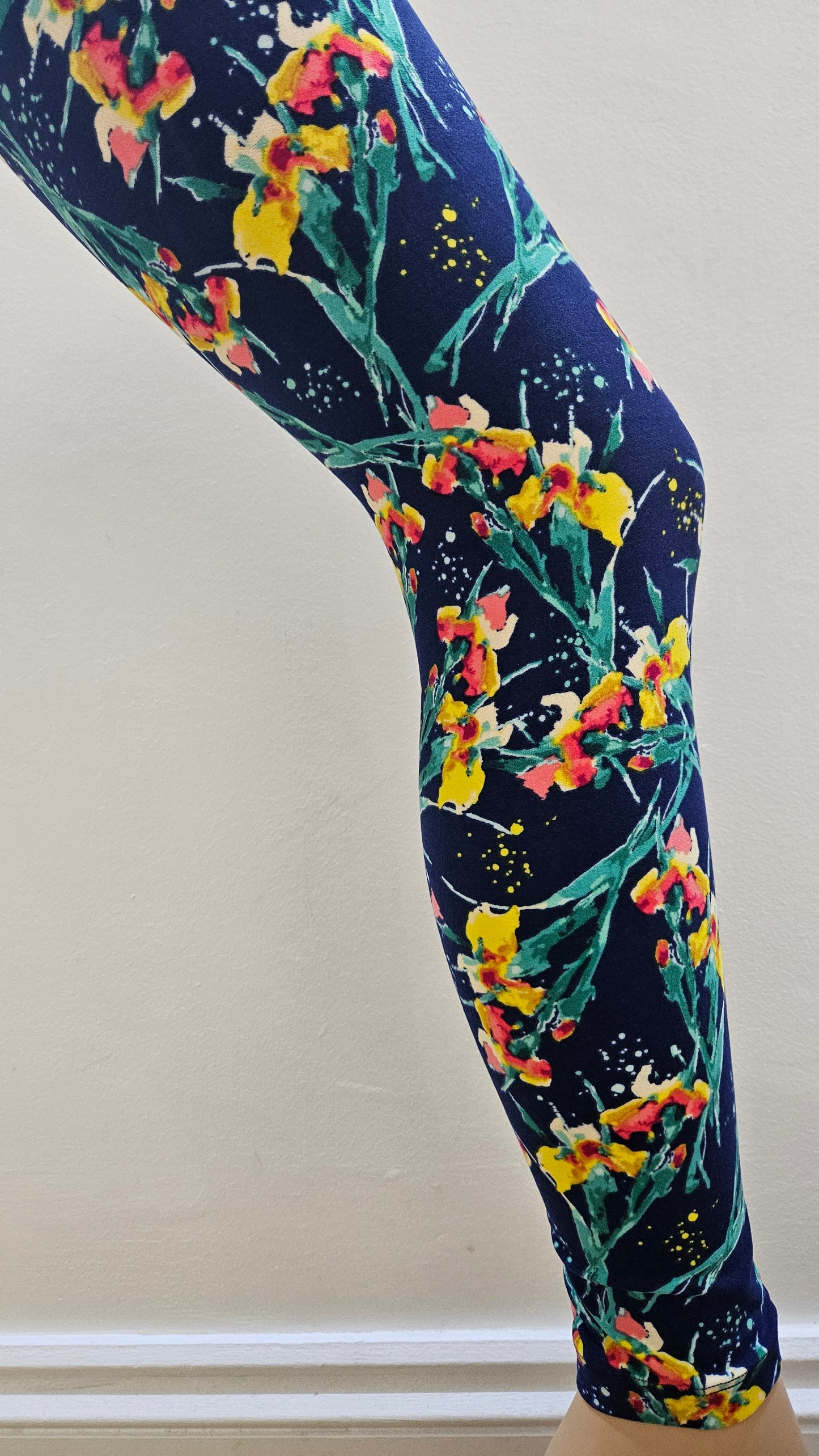 Floral-patterned leggings on a white background