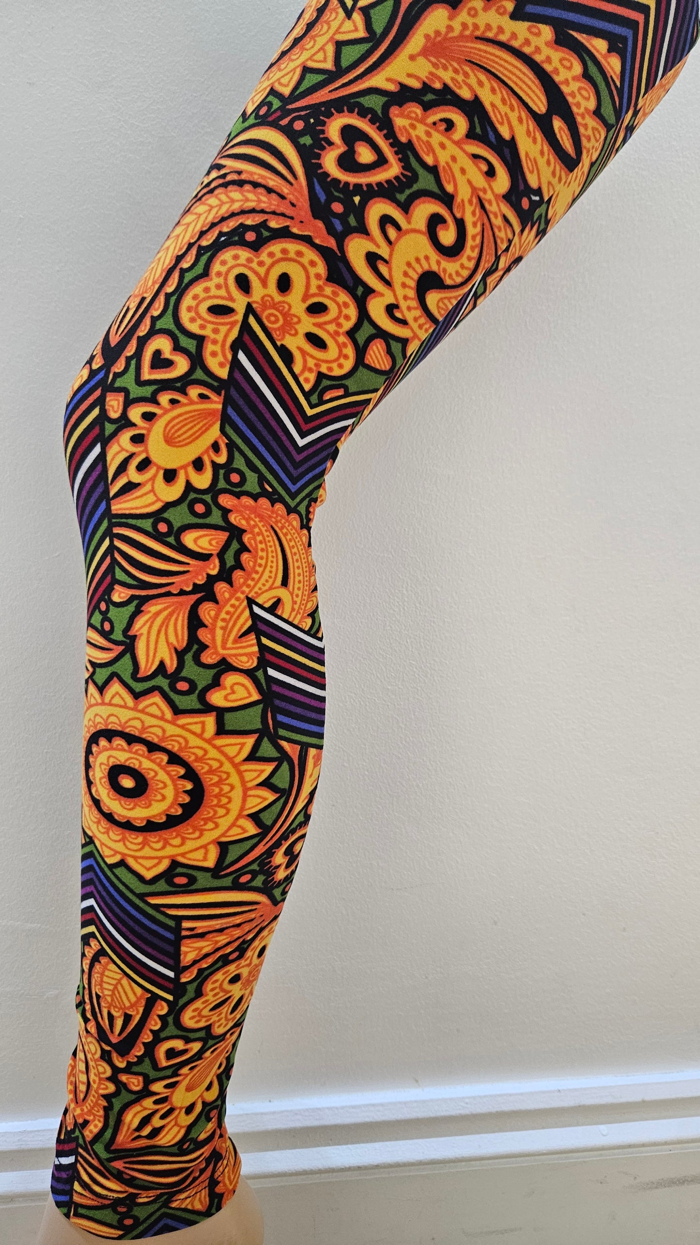 Colourful patterned leggings on a white background