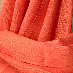 Close-up of orange-colored scarf with a soft texture