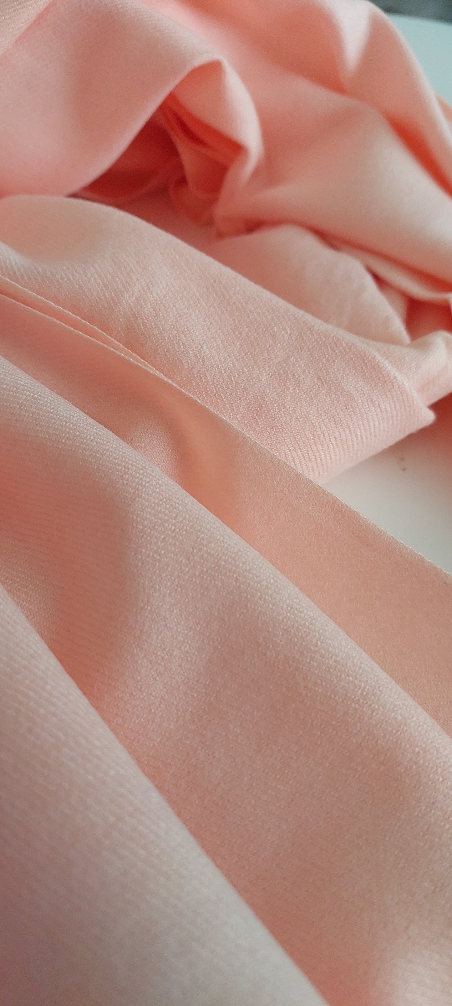 Close-up of pink pashmina with soft lighting