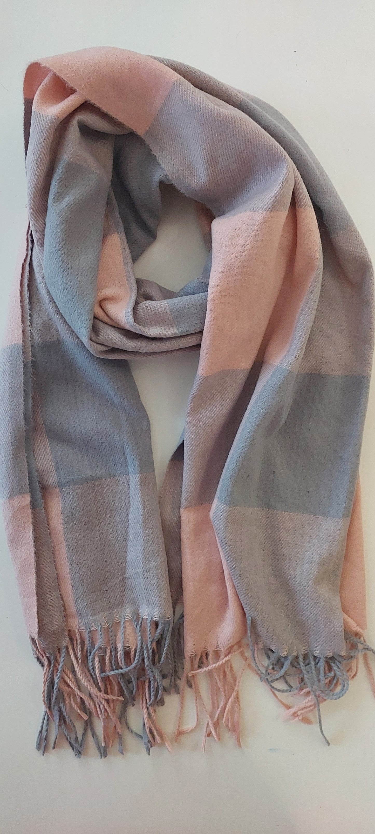 Image of Pink and grey checkered scarf laid out flat on a white background