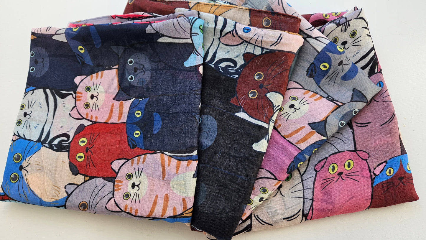 Array of Cat Scarves laid on white background