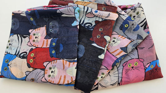 Array of Cat Scarves laid on white background