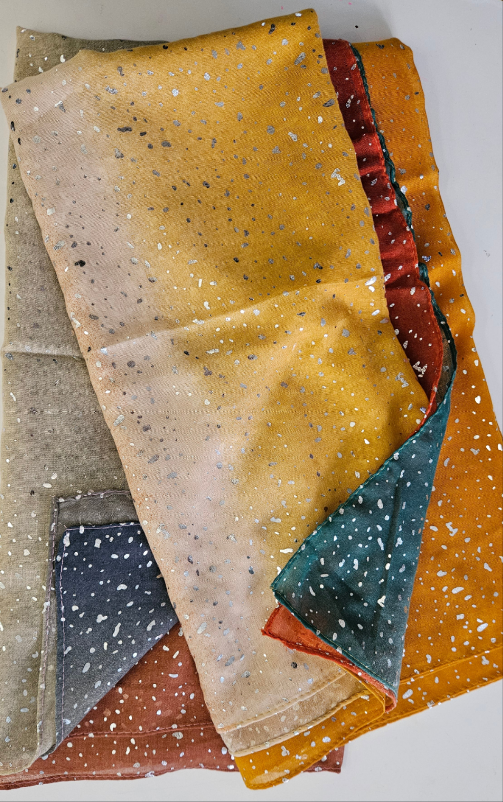 Selection of colour fade scarves with silver glitter splatters