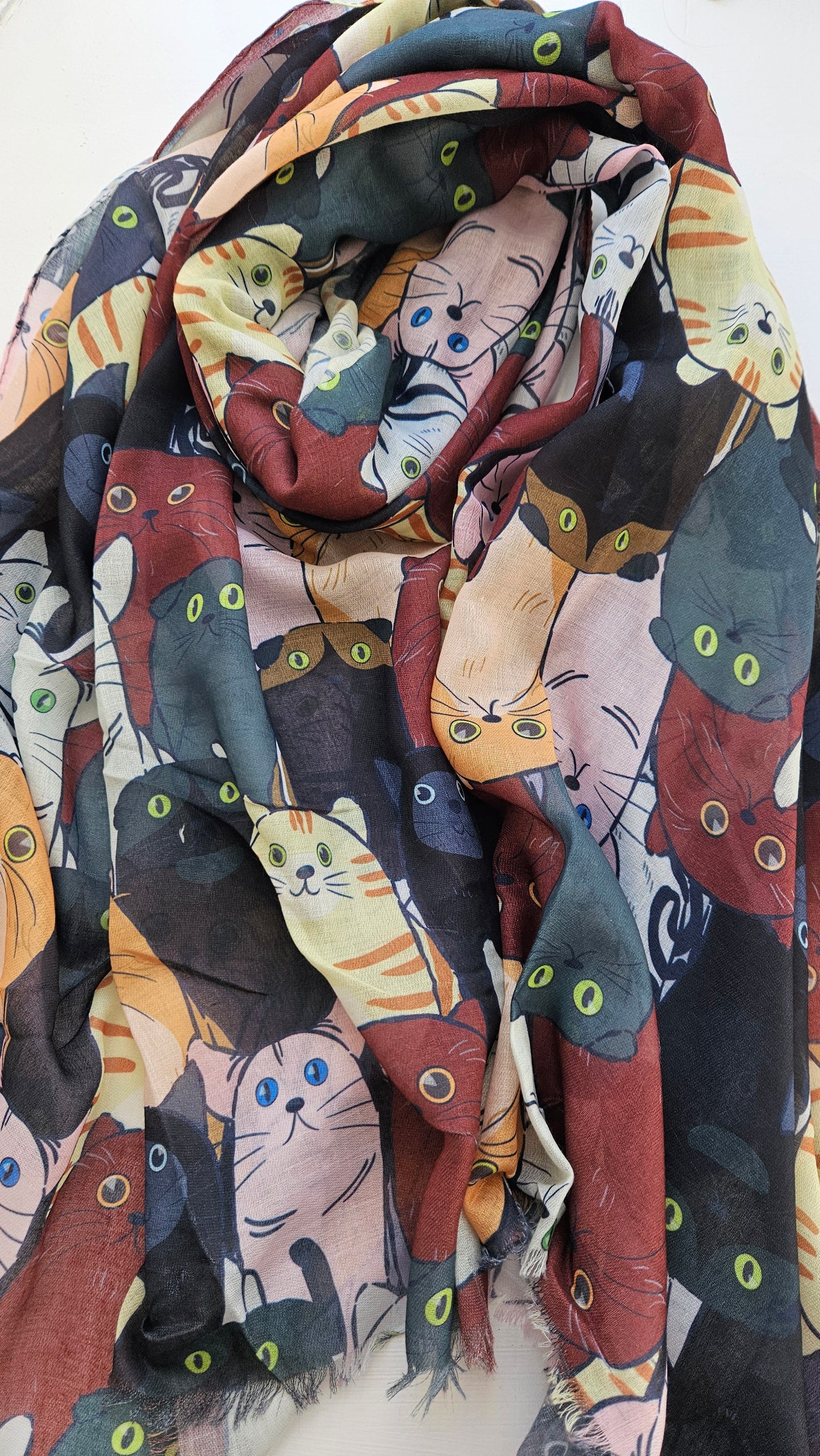 Scarf with black, teal and brown cats on it