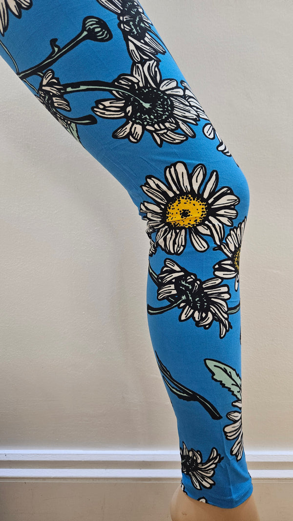 Blue leggings with floral pattern on a white surface