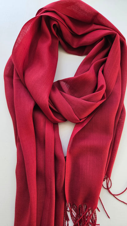 Burgundy Red scarf with tassels on a white background