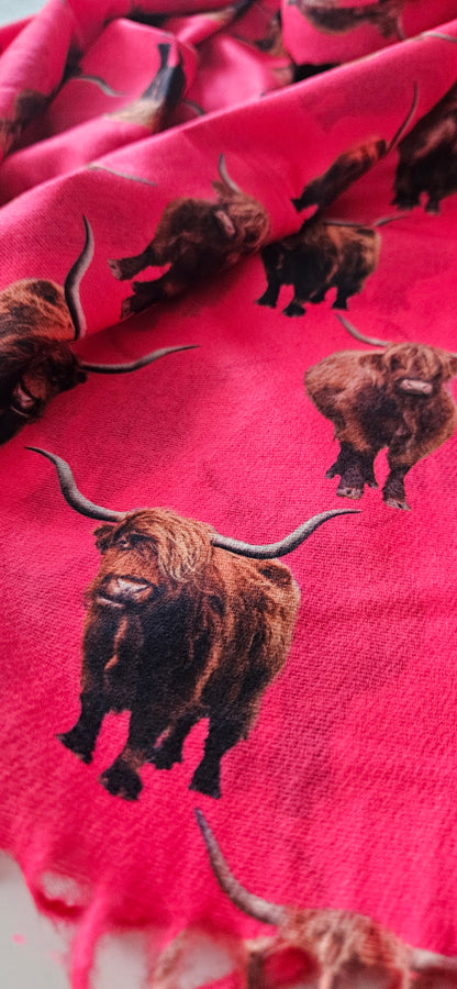 Fuchsia scarf with highland cow pattern on