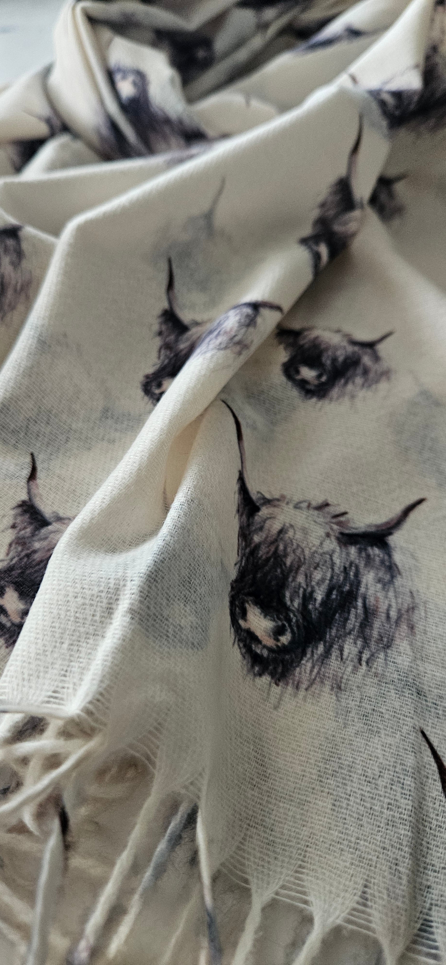 Close-up of cream black & white highland cow pattern