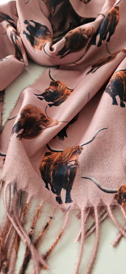 Scarf with highland cow print pattern on a light pink background