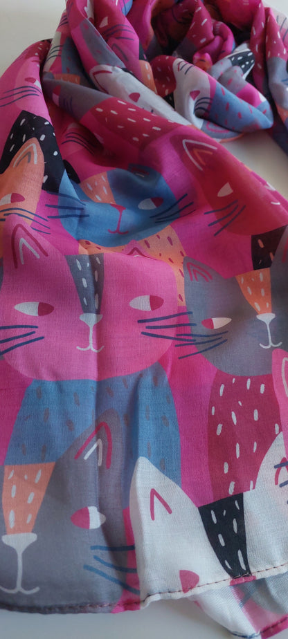 Close-up of Pink Scarf with cat pattern on a white background