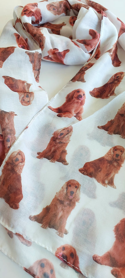 Close Up image of the ends of the White scarf with tan Cocker Spaniels on