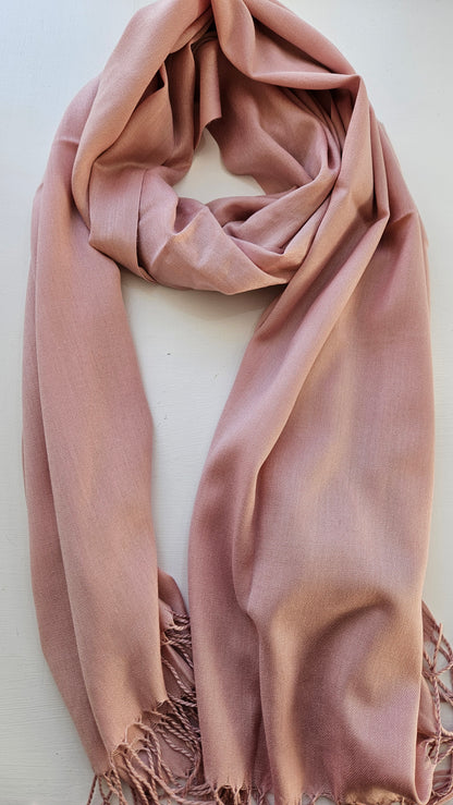 Dusty Pink scarf with tassels on a white background
