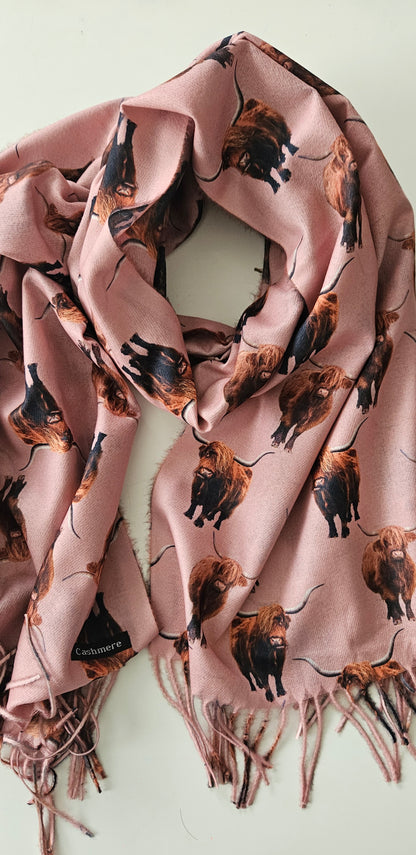 Pink scarf with highland cow print on a white background