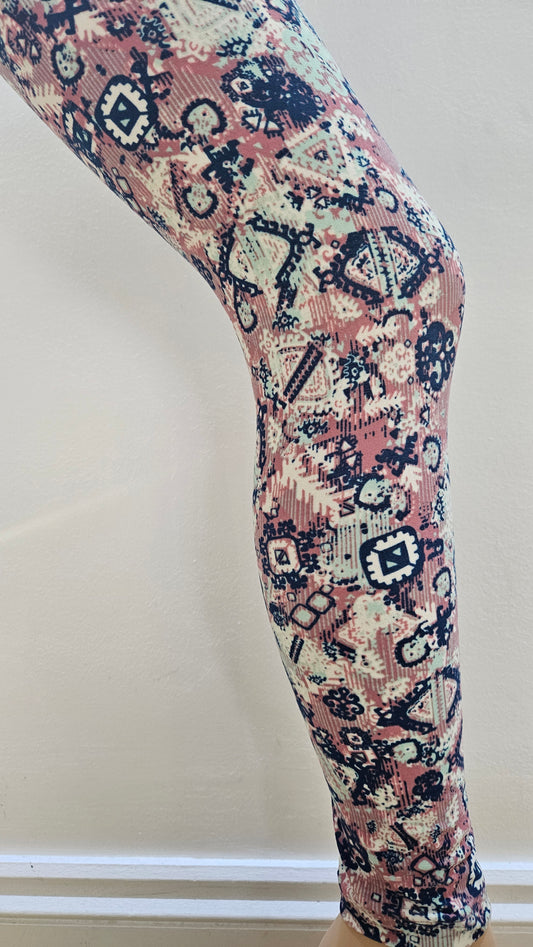 Decorative leggings with intricate pattern on a white background