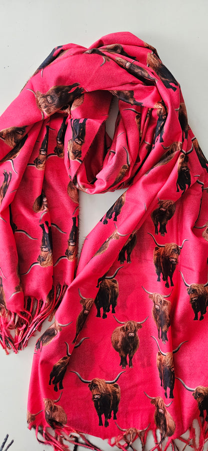 Fuchsia Pink scarf with Highland Cow pattern on a white background