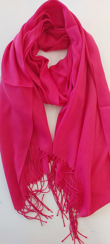 Fuchsia Pink scarf with tassels on a white background