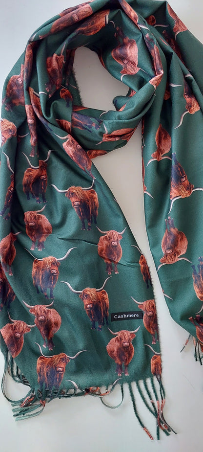 Bottle Green pashmina with highland cow pattern on a white background