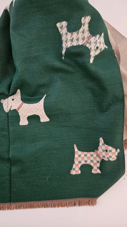 Green scarf with embroidered dog patterns on a white background