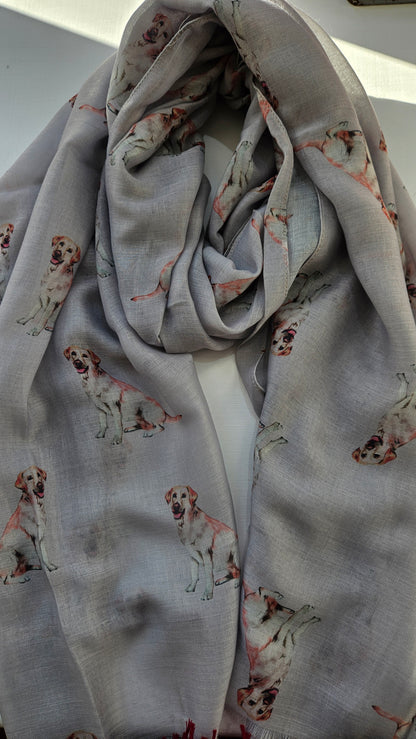 Folded scarf with small golden Labrador dog prints on a white background