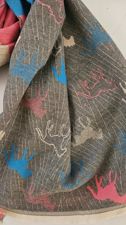 Scarf with horse pattern in pink, blue, and cream on a grey background