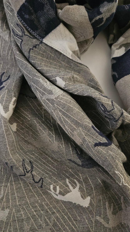 Close-up of a patterned scarf with horse designs.