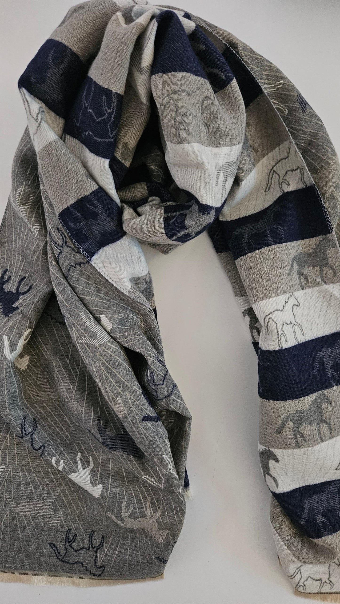 Grey, white and navy scarf with horse pattern on a white background