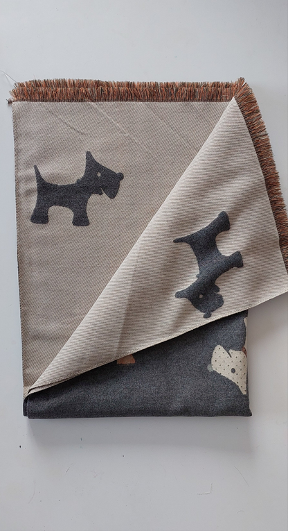 Folded scarf with Scotty dog illustrations on a white background