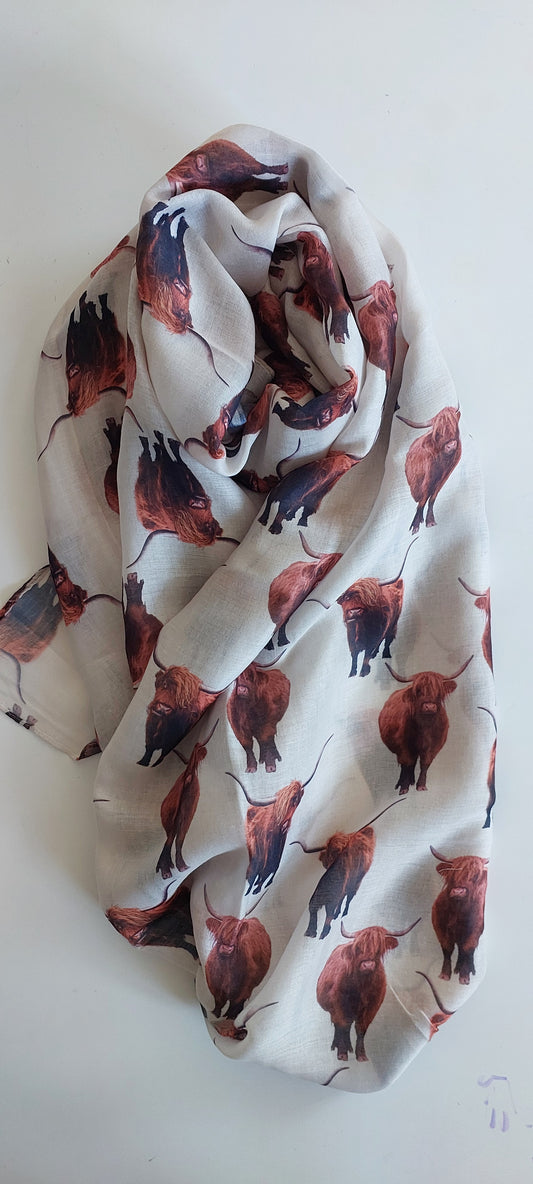 Cream Highland Cow patterned scarf on a white background
