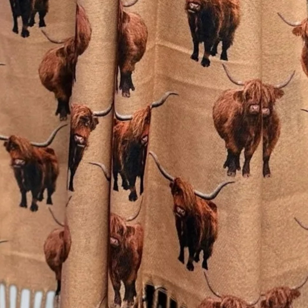 Highland Cows printed in colour all over a tan coloured scarf
