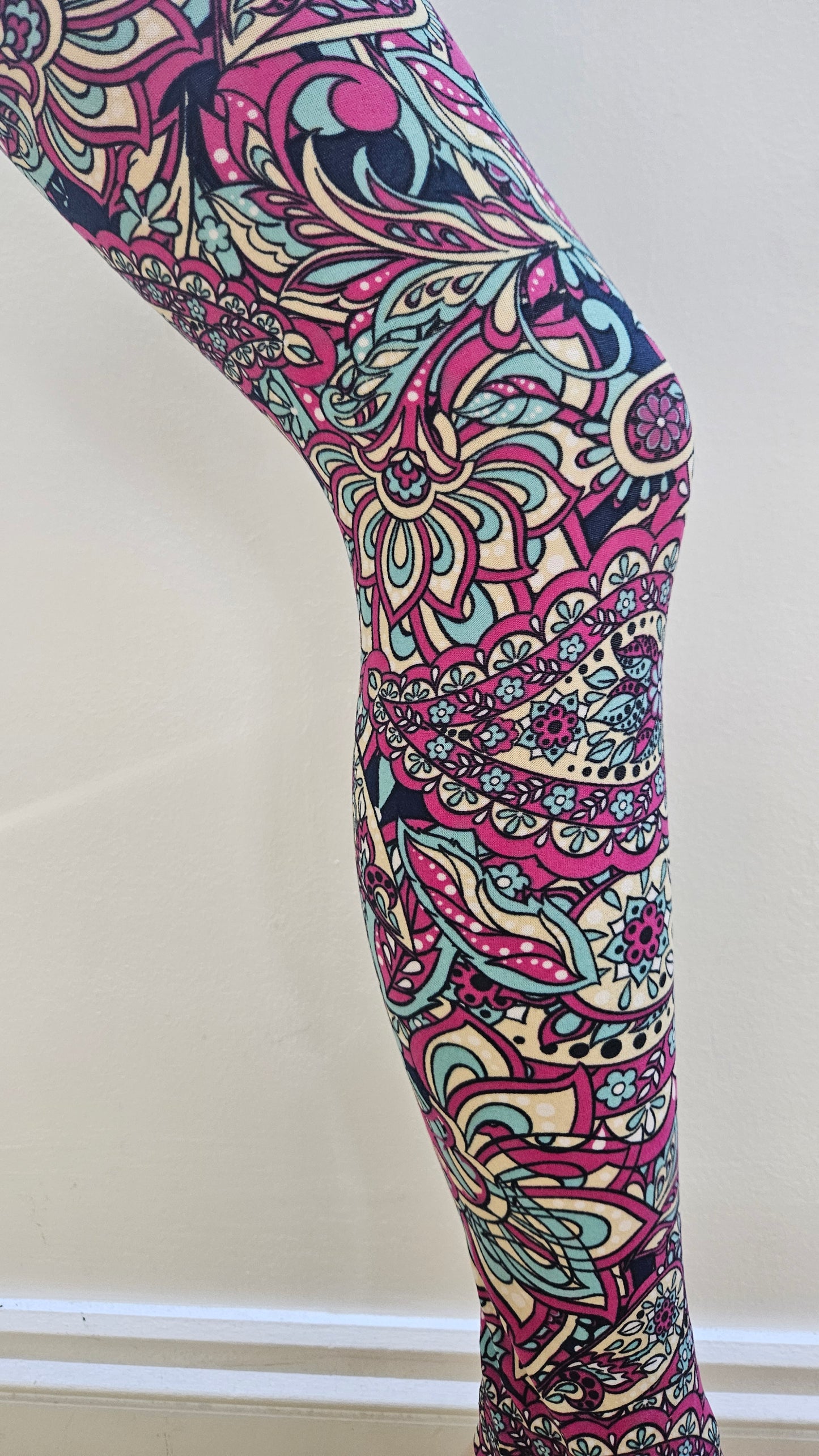 Colorful patterned leggings on a white background