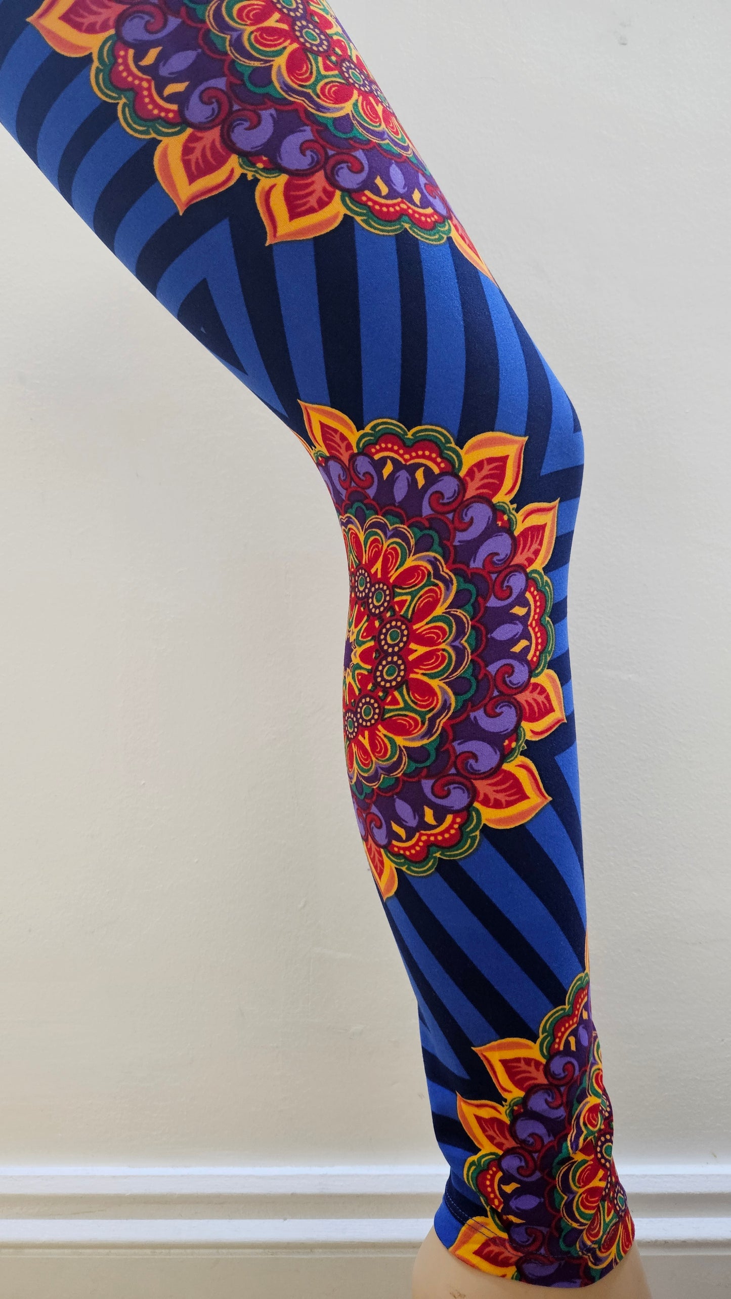 Colourful patterned leggings on a white background