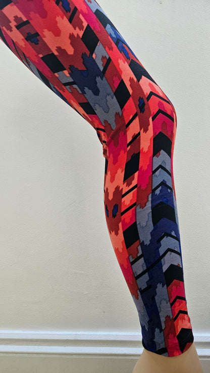 Colourful patterned leggings on a white background