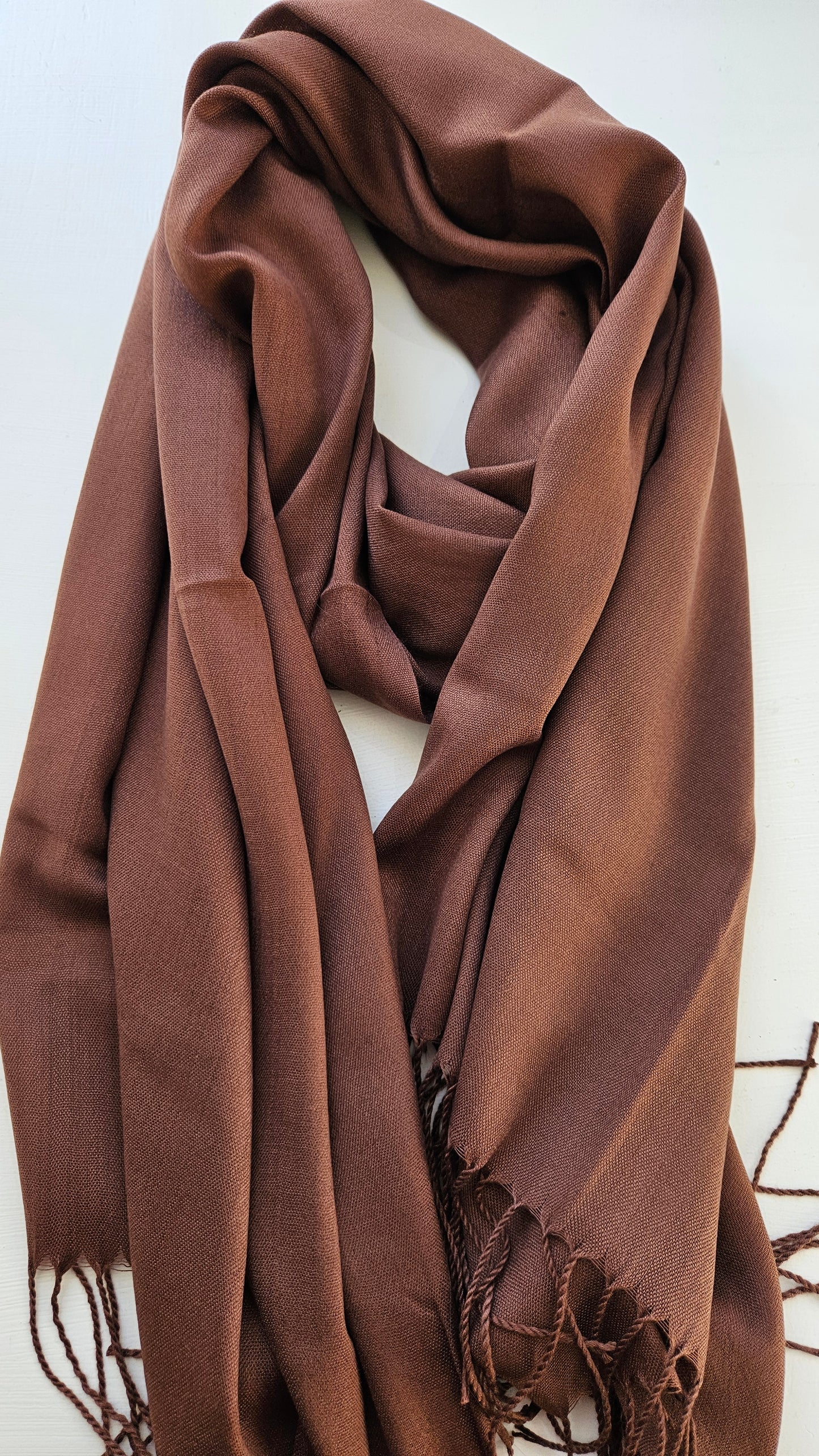 Mocha Brown scarf with tassels on a white background