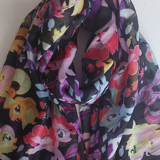 Colourful scarf with cartoon pony design on a black background