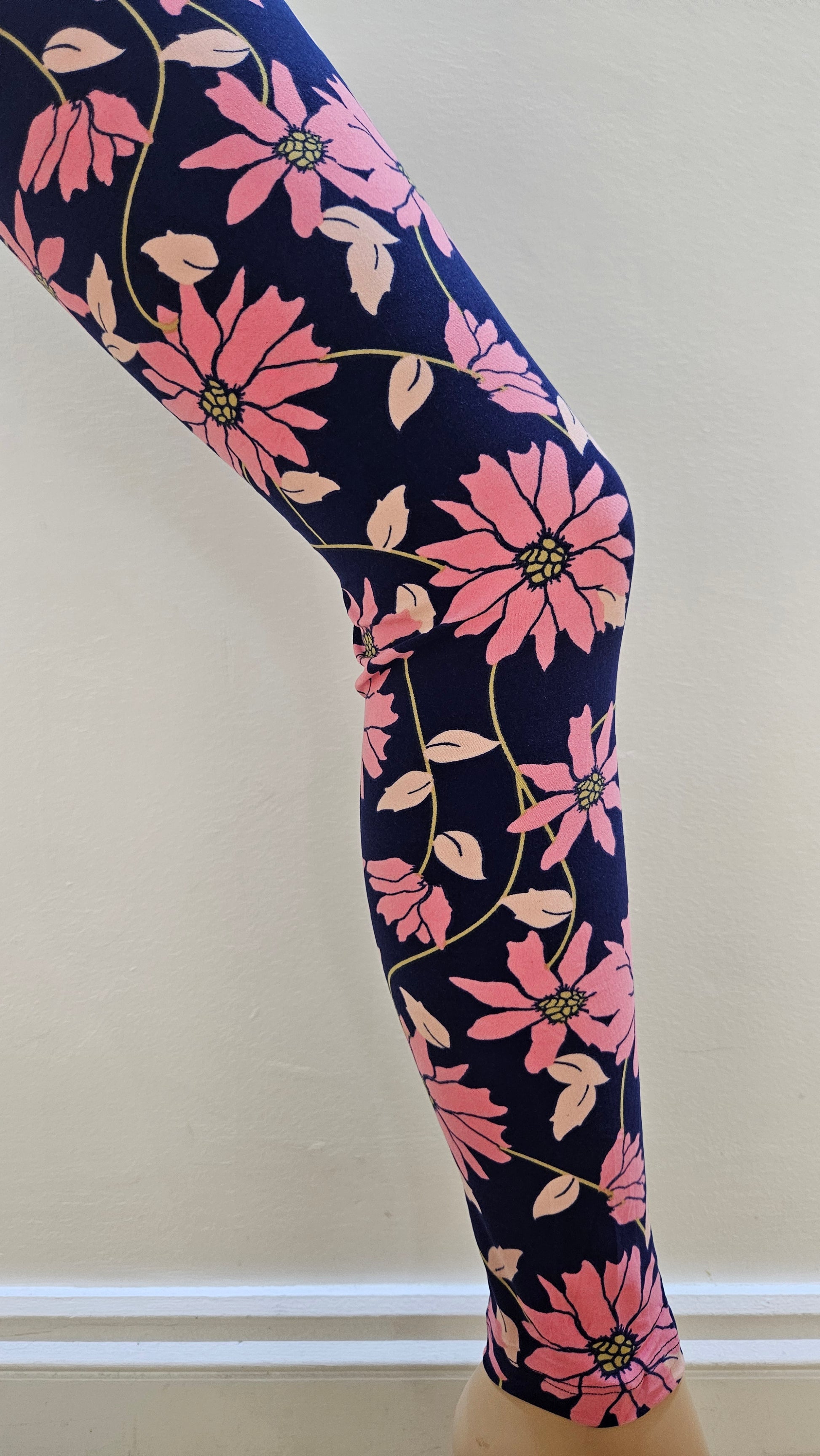 Floral-patterned legging on a white background