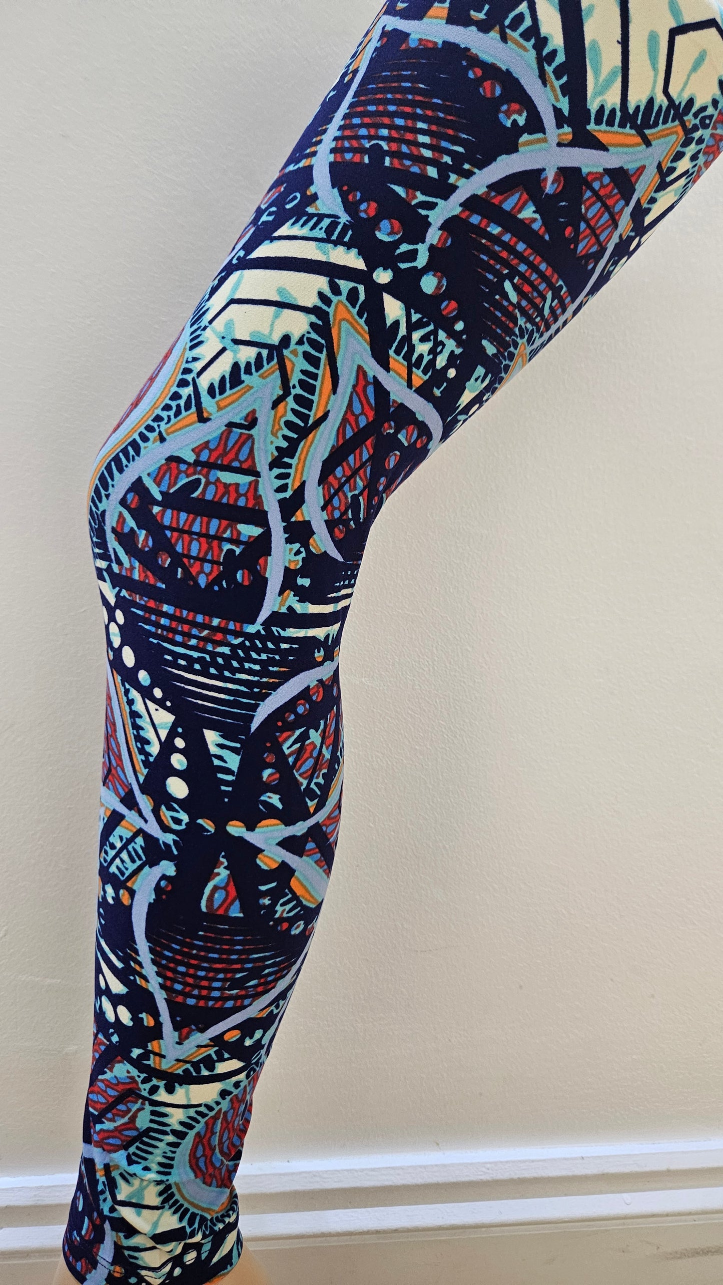Colourful leggings with abstract pattern on a plain background