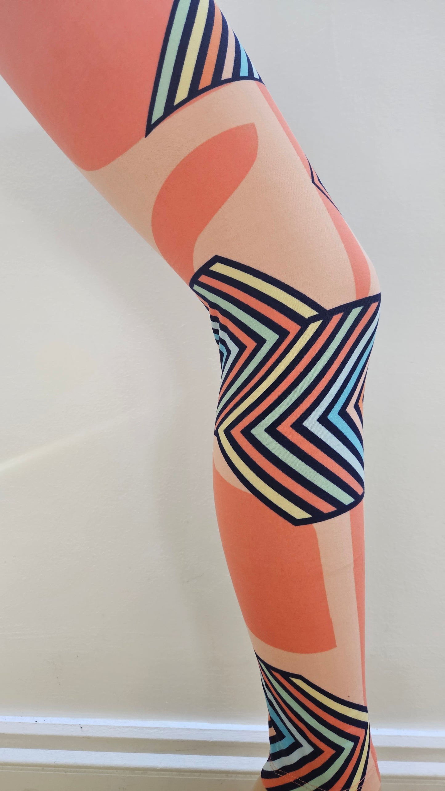 Colorful abstract leggings on a white background