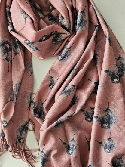 Pink scarf with black & white highland cow on a white background