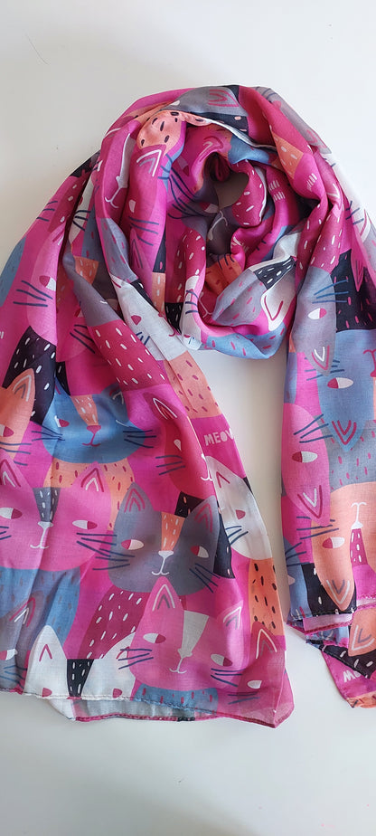 Pink Colourful scarf with cats making side eye pattern on a white background