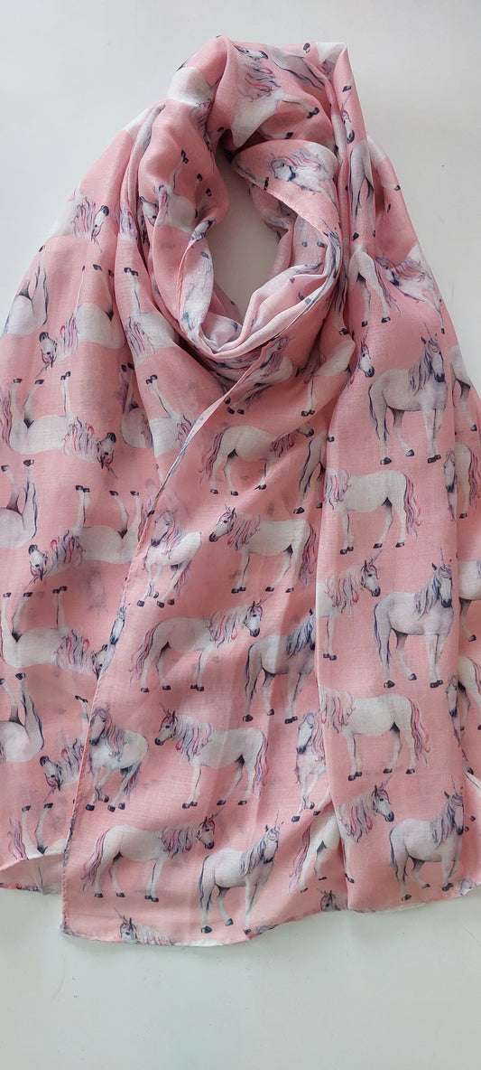 Pink scarf with a unicorn pattern on a white background