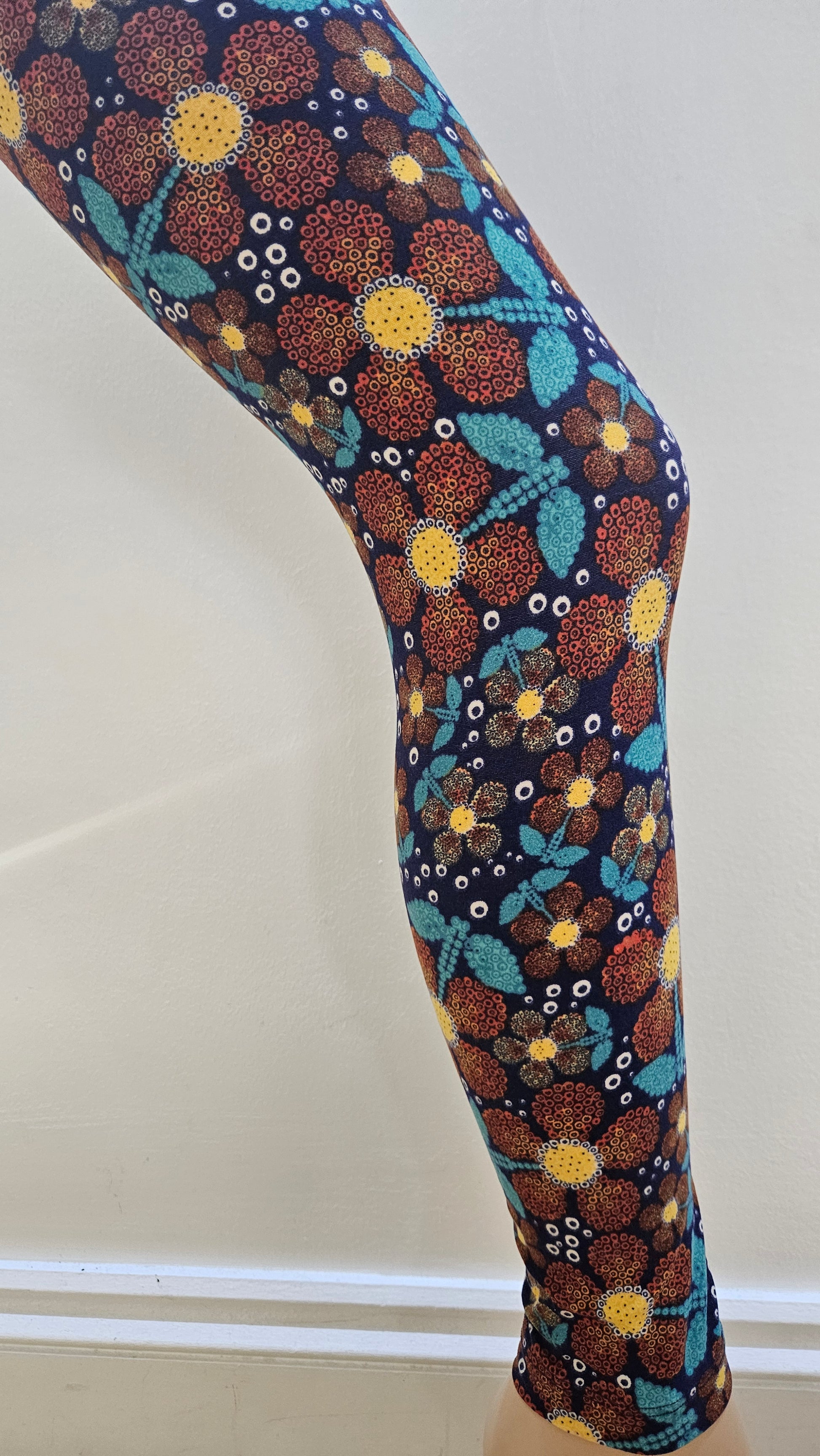Decorative leggings with a floral pattern on a plain background