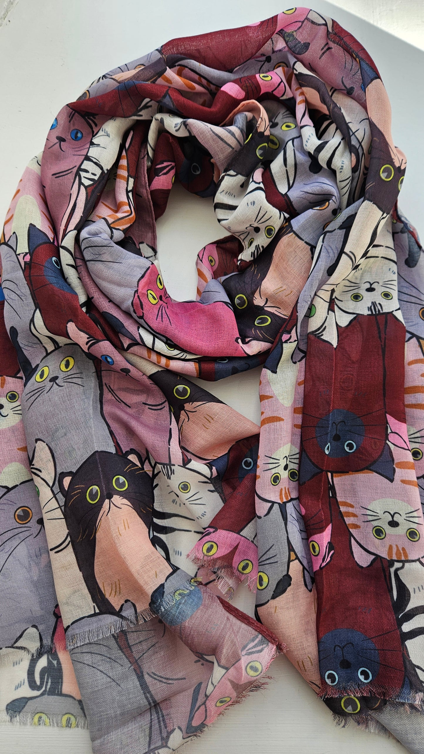 Scarf with red and grey cats on it