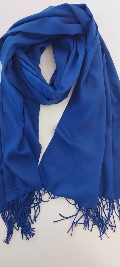 Royal Blue scarf with tassels on a white surface