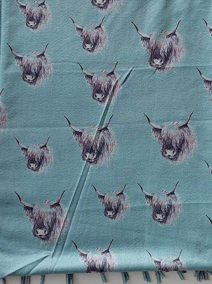 Pashmina with highland cow pattern on a white background